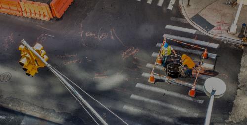 Utility workers at manhole