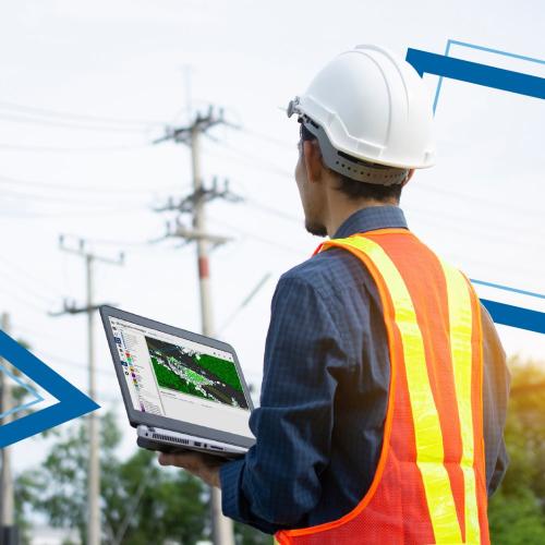 Electric engineer in the field with laptop